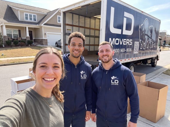 Customer selfie with LD Movers crew beside the truck